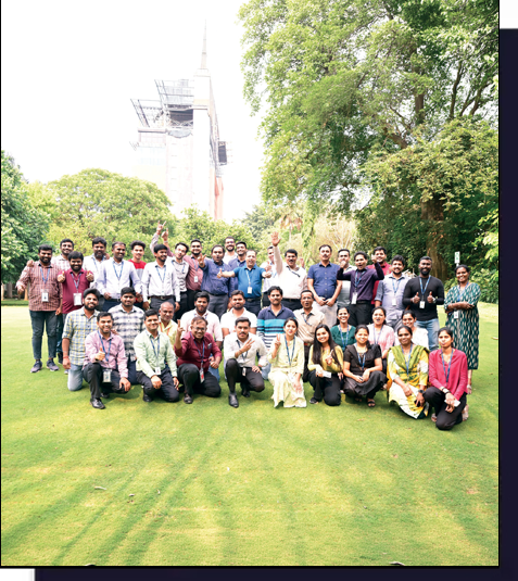 Employees of Syngene sitting together.